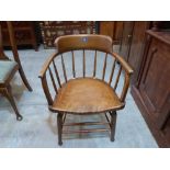 A stickback smoker's bow elbow chair