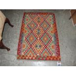 A Vegetable dyed wool Choli Kelim rug. 1.24m x 0.84m
