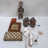 An ethnic carved treen fertility figure, a pair of Tibetan slippers and other objects