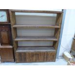 A rustic bespoke wood open shelving unit made by the Nottingham firm 'Eat, Sleep, Live', the three
