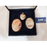 An 18ct mounted shell cameo pendant and two shell cameo brooches