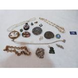 A shell cameo brooch, Whitby jet pendant and other jewellery