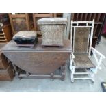 An oak gateleg table; a Victorian footstool; ottoman (A.F.) and an American rocking chair