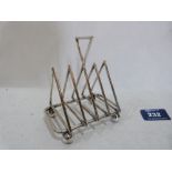 A plated toast rack in the manner of Dr. Christopher Dresser. 4' wide