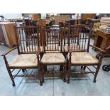 A set of six oak Lancashire type spindle back chairs with rush seats, the set two include to