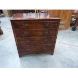 An oak chest of four long drawers. 33' wide