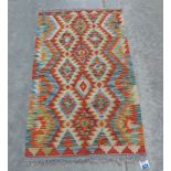 A Choli Kilim rug. 1.34m x 0.79m