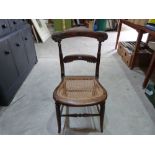 A Victorian faux rosewood bedroom chair with caned seat