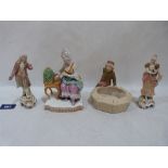 A German, probably Meissen, group of a lady with birdcage, 6' high (chips); a pair of continental