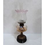 A Victorian oillamp with clear glass fount