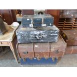 Three vintage cases and a cabin trunk