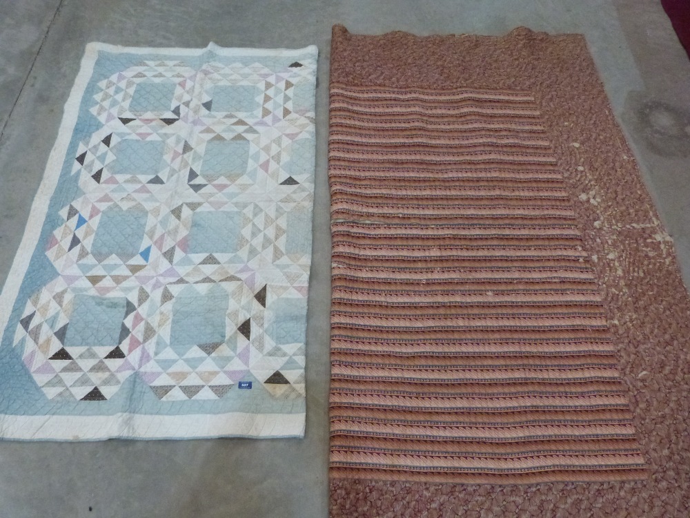 A vintage French quilt and a vintage patchwork quilt