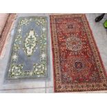 A red ground rug 70' x 36' and a smaller blue ground oriental rug