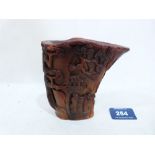 A Chinese carved libation cup. Seal mark to base. Possibly horn. 4¼' high