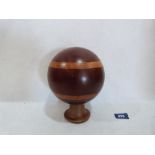 A treen orb on stand. 6' diam