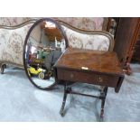 A mahogany dropleaf occasional table and a mahogany oval wall mirror