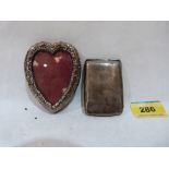 A silver heart form photograph frame and a silver vesta case
