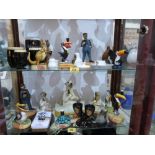 A collection of Guinness themed resinous and ceramic figures and objects to include some Carlton
