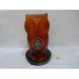 A Guinness Year 1980 Licensed Victuallers amber glass owl moneybox. 13' high