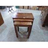A nest of three walnut occasional tables