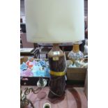 A treen table lamp. Signed to base