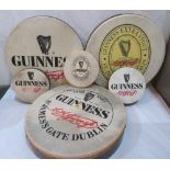 A collection of six Guinness themed bodhrans (Irish drums)