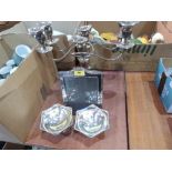 A pair of plated three light candelabra, a pair of plated bonbon dishes and a photograph frame