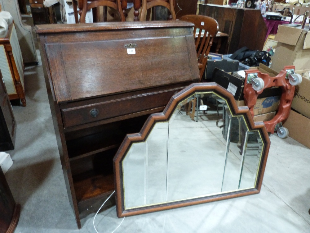 A 1930s oak students' bureau and a Deco style wall mirror