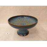 A 20th century English pottery pedestal fruit bowl with inused decoration of a sunburst on a