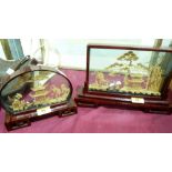 Two cased oriental cut cork dioramas