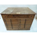 An early 20th century set of merchant's drawers, Brough's Woven Initial Letters and Figures, the