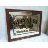 A Guinness advertising pub mirror. 18' x 24'