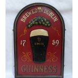 A Guinness advertising wall plaque. 35½' high