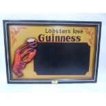 A 'Lobsters Love Guinness' wood wall plaque. 23½' wide
