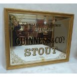 A Guinness and Co's Stout advertising pub mirror. 18' x 24'