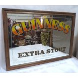 A Guinness advertising put mirror. 22' x 32'