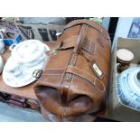 A leather Gladstone bag