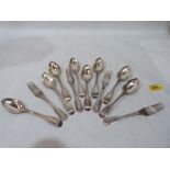 A collection of George III silver cutlery, comprising eight dessert spoons and four forks. London