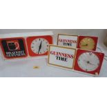 Three 1970s Guinness bar clocks