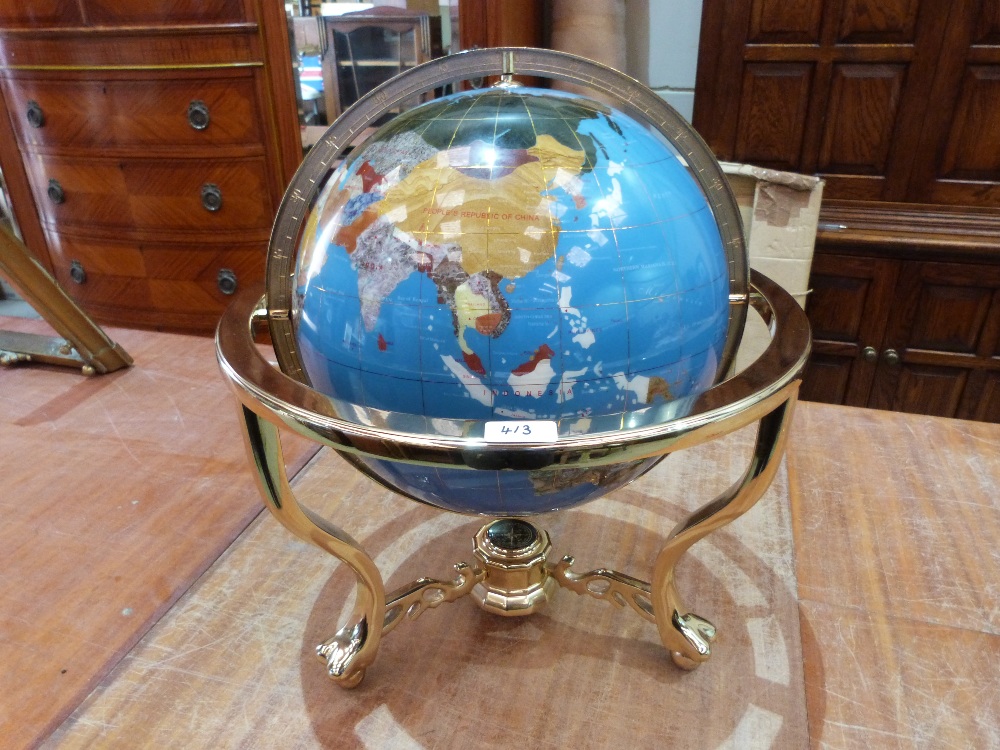 A terrestial globe on gilt metal stand