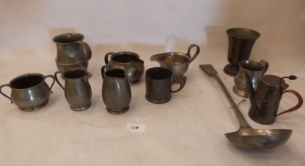 Seven items of Liberty's Tudric and four other items of pewter