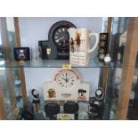 A collection of Guinness memorabilia to include two mantle clocks, wristwatches etc.