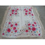 A Chinese embroidered silk shawl. 72' x 60'
