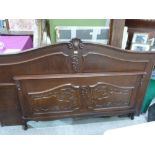 A 4'6' French style oak bedstead
