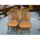 A set of four lath back kitchen chairs