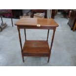 A 19th century mahogany two tier side table with base drawer. 31' high