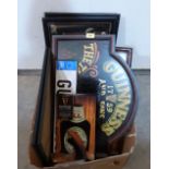 A box of Guinness themed wall plaques, pub mirrors etc.