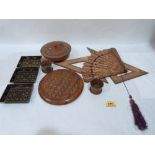 A collection of treen objects to include a solitaire board, three lacquer and gilded dishes,