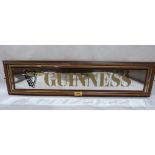 A Guinness advertising pub mirror. 30' wide