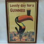 A framed Guinness print on textile, 'Lovely Day For a Guinness'. 30' x 20'